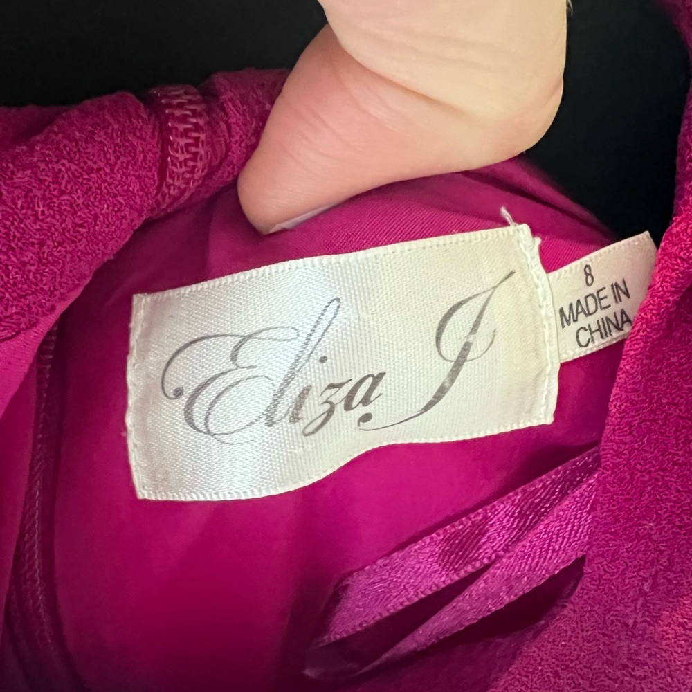 Purple/magenta shift dress with bow at neckline.